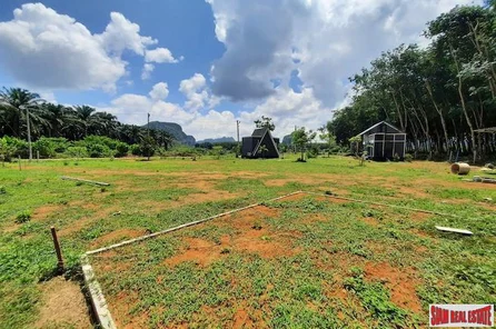 Land Plot for Sale with 3 Small Houses in Quiet Area of Nong Thaley - Good for Business Investment or Private Residence