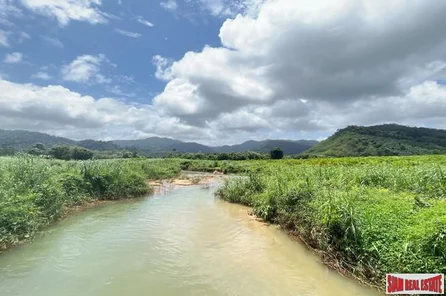 A large plot of 101 rai with clear water stream and mountain view for sale in Khuekkhak, Phangnga