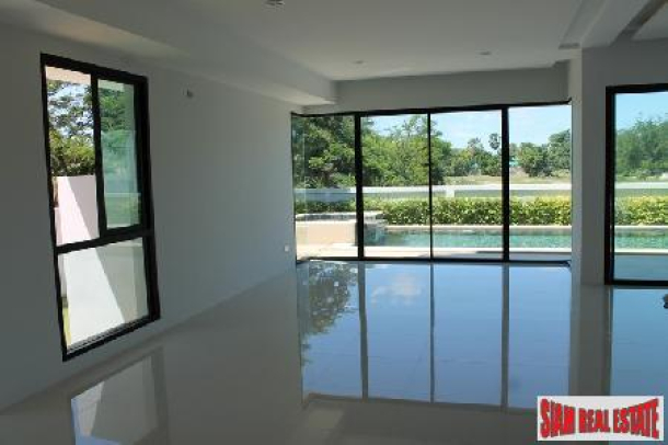 Modern style house with private swimming pool only a few steps to the beach.-3