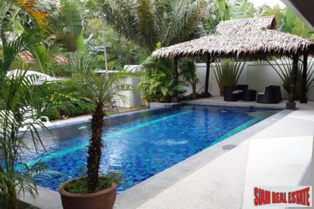 Modern four-bedroom private pool villa with jacuzzi and located near the beach-7