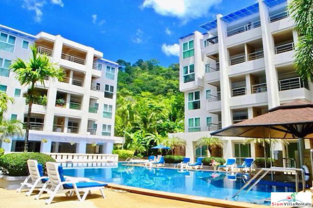 Patong Harbor View Condo | Fully Furnished Two Bedroom  Condo with Pool Views for Rent-1