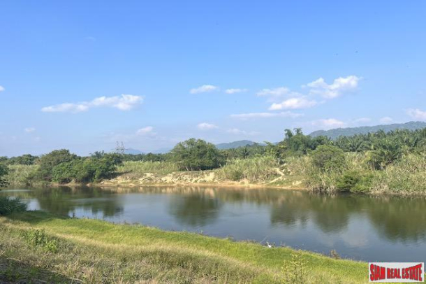 Almost 10 Rai Land Plot with Canal and Mountain Views for Sale in Takua Pa, Phang Nga-1
